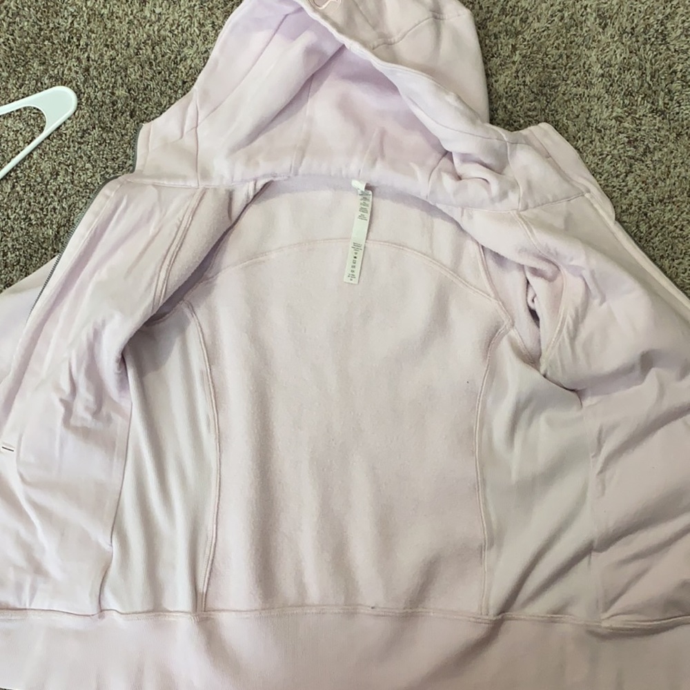 This is a light pink lululemon athletic jacket. It is a size 8. - Picture 4 of 4